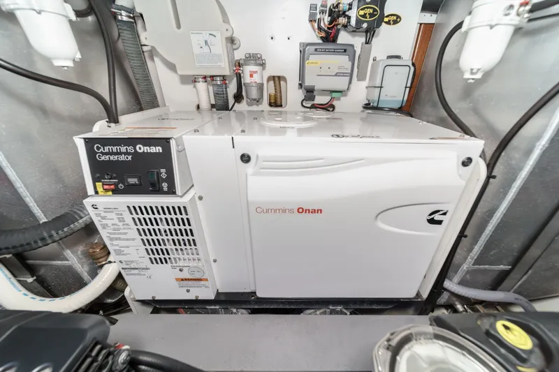 The Riviera Yacht Photos Pics Cummins Onan generator in 2017 Monte Carlo MC5S engine room, showcasing advanced marine technology.