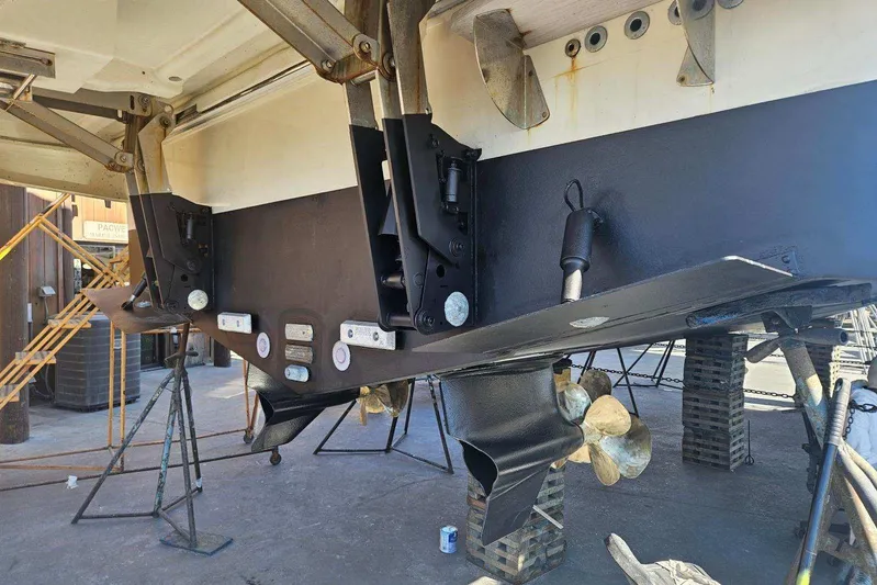 The Riviera Yacht Photos Pics 2017 Monte Carlo MC5S yacht under maintenance, showcasing propellers and hull structure.