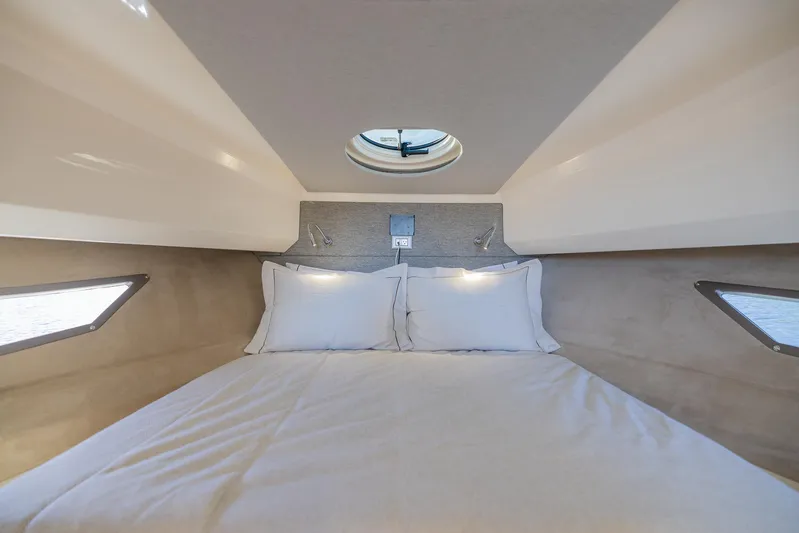  Yacht Photos Pics Luxurious cabin interior of 2024 Sessa Marine C36 OB yacht with cozy bedding.