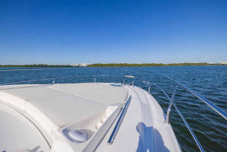  Yacht Photos Pics 2024 Sessa Marine C36 OB yacht on calm water under clear blue sky.