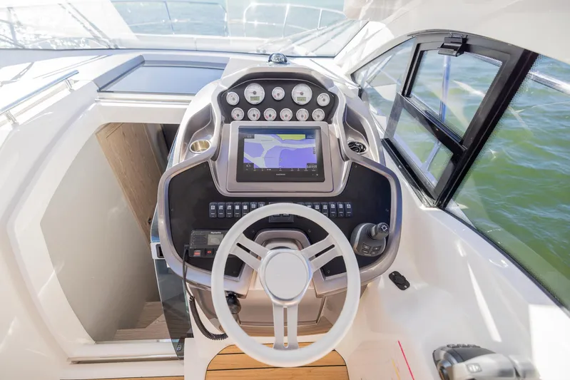  Yacht Photos Pics 2024 Sessa Marine C36 OB boat cockpit with modern navigation system.