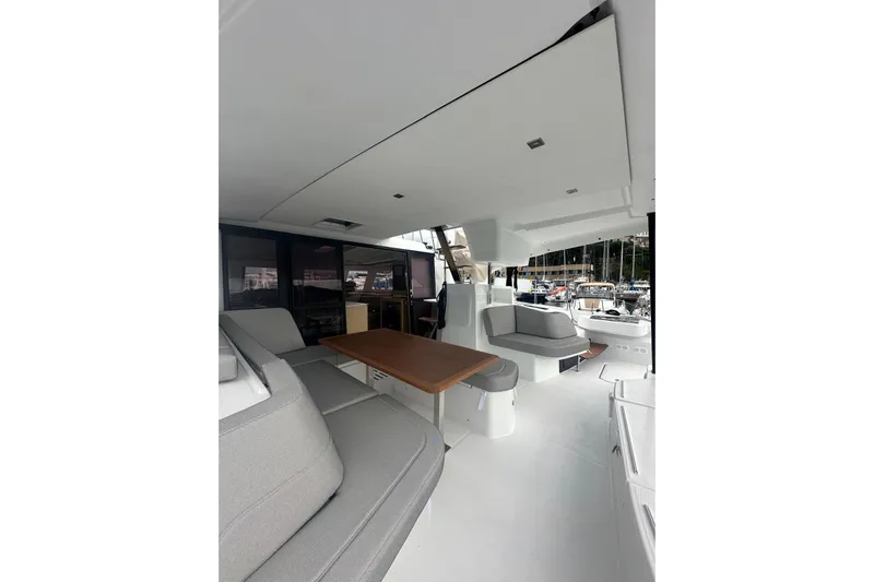  Yacht Photos Pics Spacious interior of 2025 Fountaine Pajot 41 catamaran with modern seating and table.