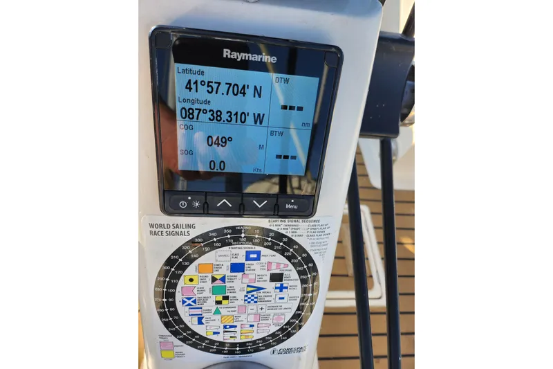 Runaway Yacht Photos Pics Raymarine navigation display on 2005 Elan 40 sailboat, showing coordinates and sailing signals.
