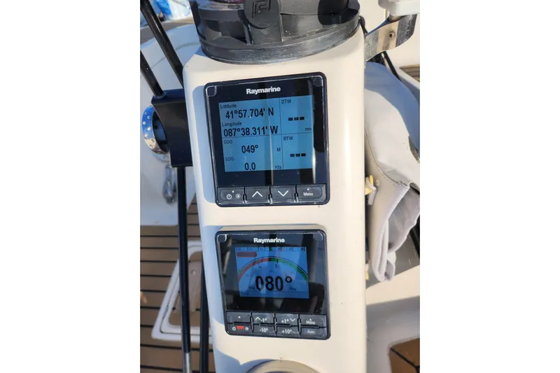 Runaway Yacht Photos Pics Raymarine navigation display on 2005 Elan 40 sailboat, showing coordinates and heading.