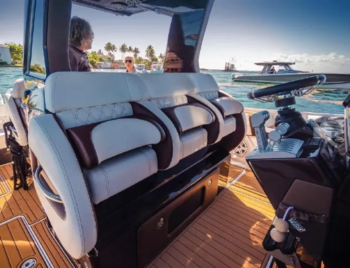  Yacht Photos Pics 2018 Nor-Tech 450 Sport boat interior with luxurious seating and modern steering console.