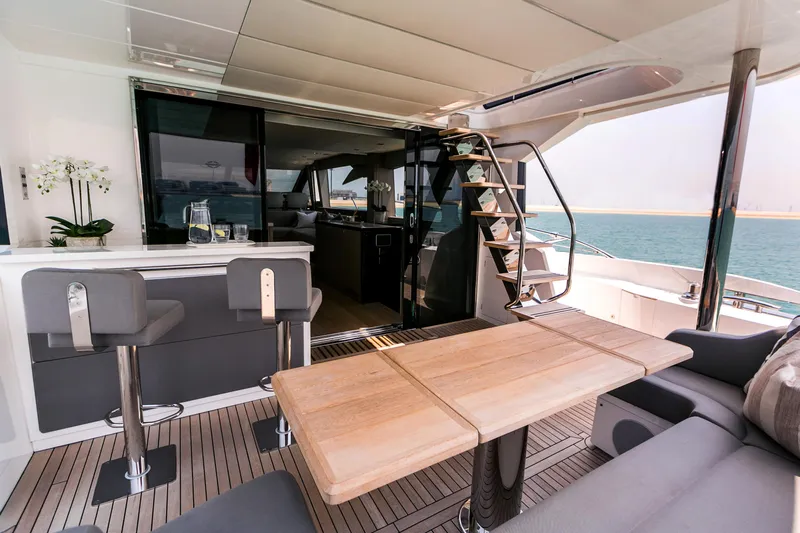 My Serenity Yacht Photos Pics Luxurious 2018 Sunseeker Manhattan 66 yacht interior with modern seating and ocean view.