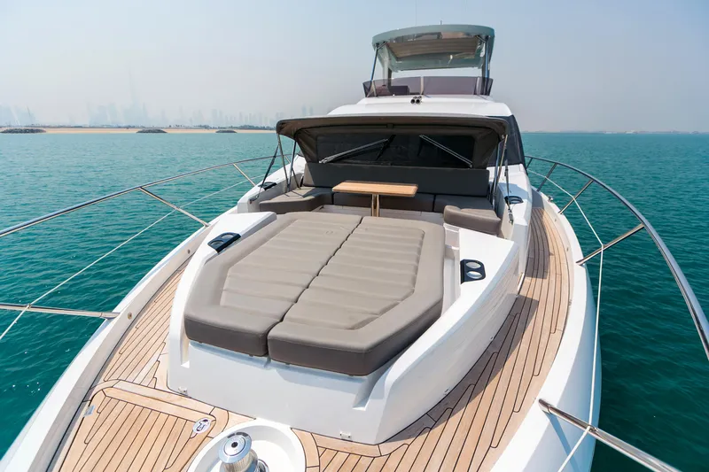 My Serenity Yacht Photos Pics 2018 Sunseeker Manhattan 66 yacht with spacious deck and luxurious seating on open water.