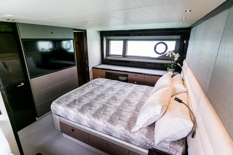 My Serenity Yacht Photos Pics Luxurious bedroom interior of 2018 Sunseeker Manhattan 66 yacht with modern decor.