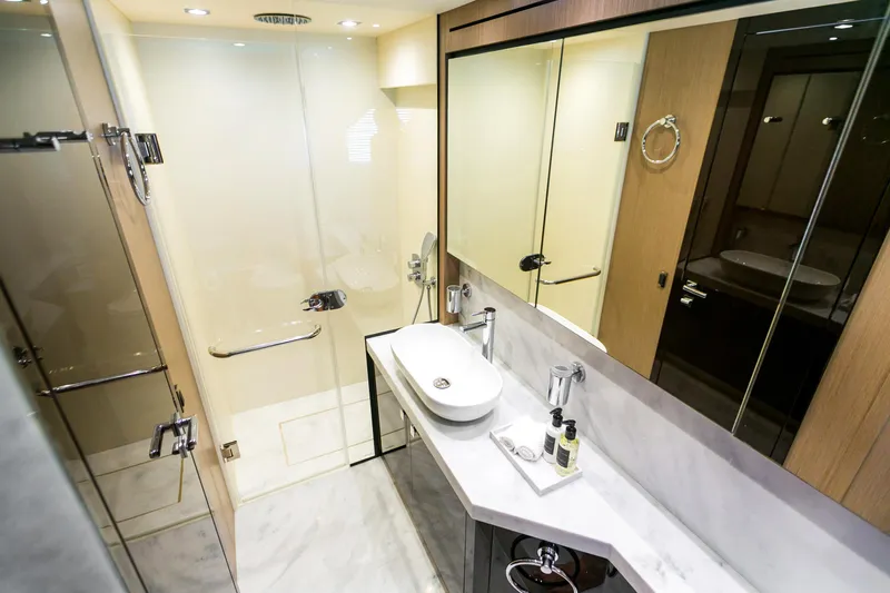 My Serenity Yacht Photos Pics Luxurious bathroom in 2018 Sunseeker Manhattan 66 yacht with modern fixtures and elegant design.