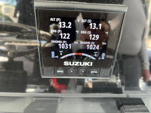  Yacht Photos Pics Suzuki engine display on Freeman 34VH, showing altimeter, engine temperature, and hours.