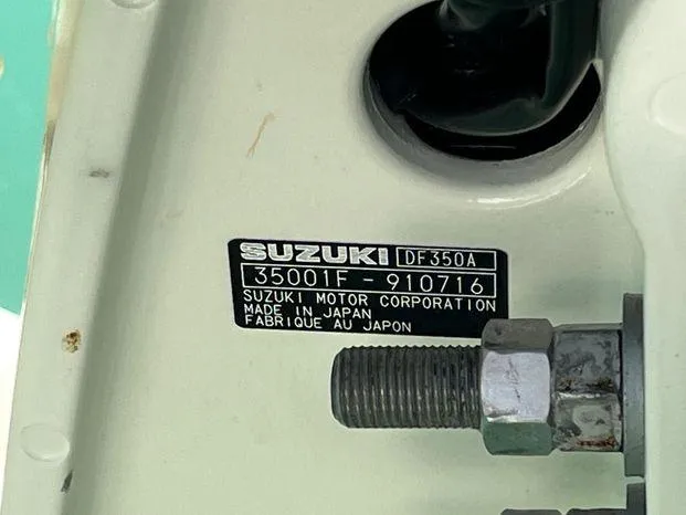  Yacht Photos Pics Label on Suzuki DF350A engine, showing serial number and manufacturing details.