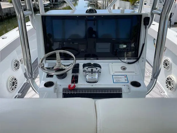 Yacht Photos Pics Freeman 34VH 2020 boat helm with steering wheel, controls, and navigation screens.