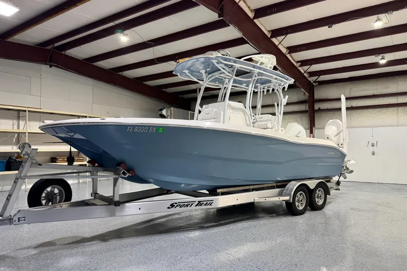  Yacht Photos Pics 2021 Sea Cat 260 boat on trailer in indoor storage facility.
