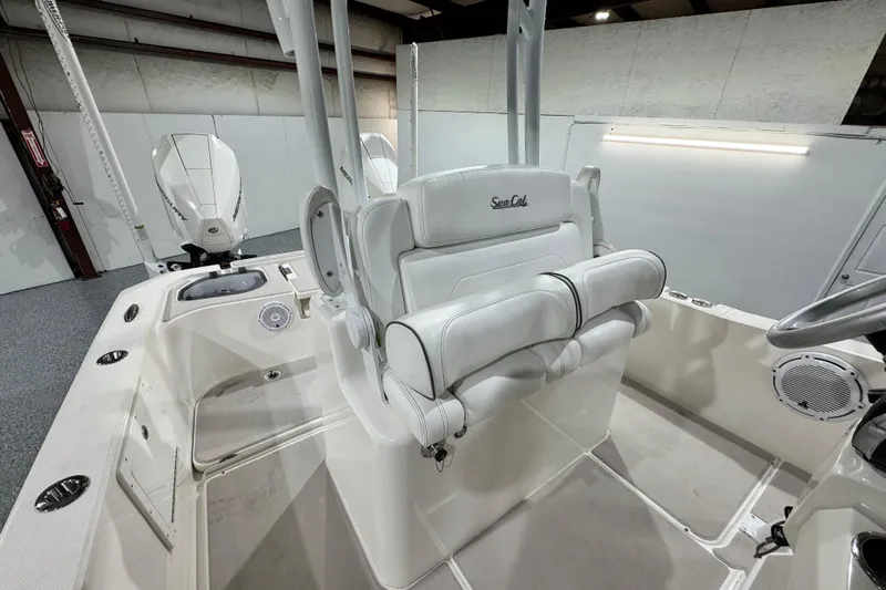  Yacht Photos Pics 2021 Sea Cat 260 boat interior with white seating and dual outboard motors.