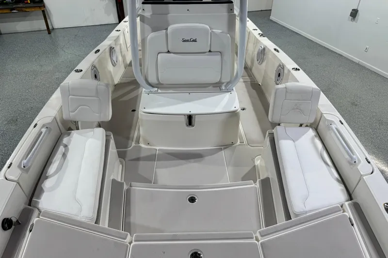  Yacht Photos Pics 2021 Sea Cat 260 boat interior with white seating and spacious layout.
