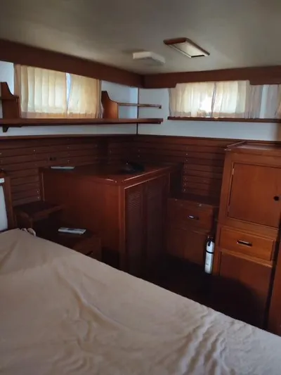 Emily Claire Yacht Photos Pics Interior of 1999 Grand Banks 42 Motoryacht with wooden cabinetry and soft lighting.