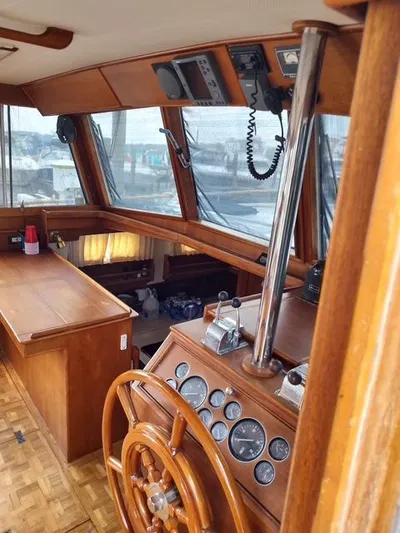 Emily Claire Yacht Photos Pics Interior of 1999 Grand Banks 42 Motoryacht with wooden helm and navigation instruments.