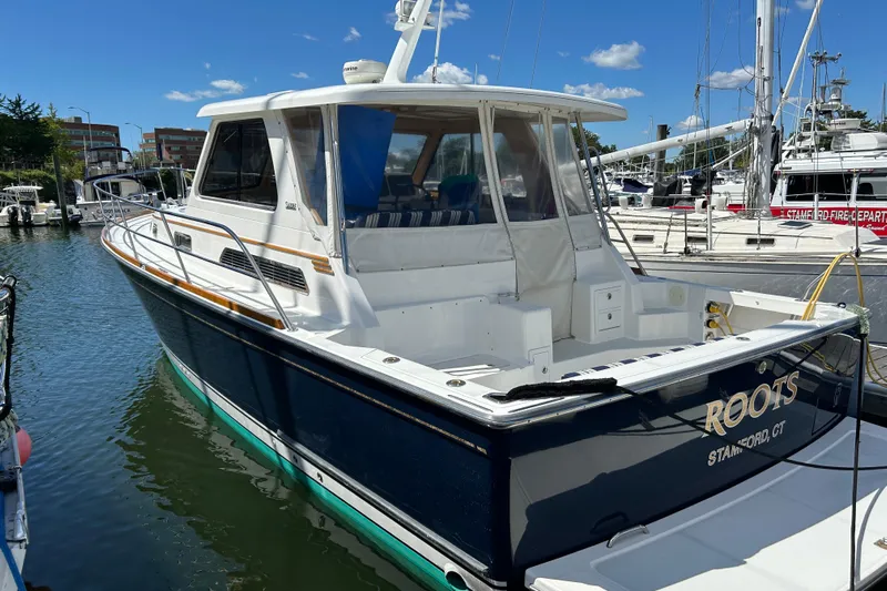  Yacht Photos Pics 2005 Sabre 38 yacht docked at marina under clear blue sky.