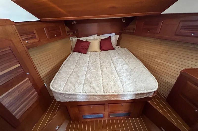  Yacht Photos Pics Luxurious cabin interior of 2005 Sabre 38 yacht with cozy bedding and wood finish.