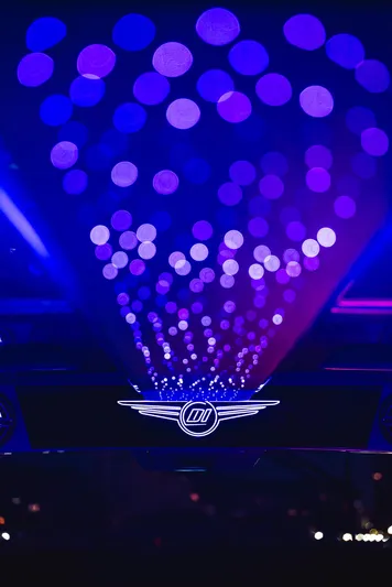  Yacht Photos Pics Futuristic Deep Impact 499 Sport 2026 with vibrant blue and purple lights.