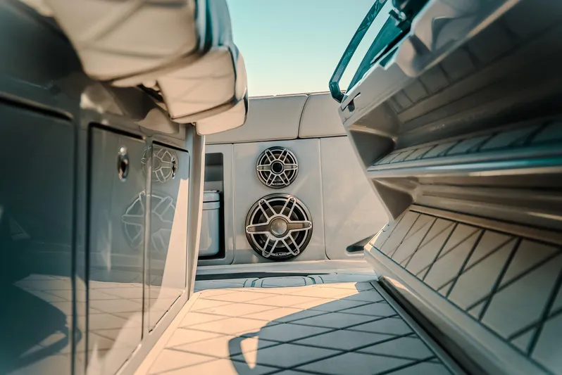  Yacht Photos Pics Interior view of 2026 Deep Impact 499 Sport boat, featuring sleek design and modern speakers.