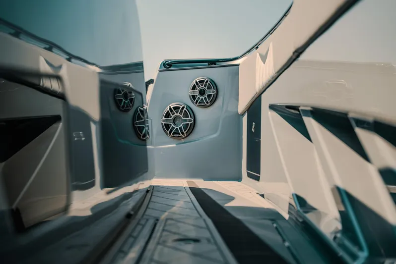  Yacht Photos Pics 2026 Deep Impact 499 Sport boat interior with sleek design and modern audio system.