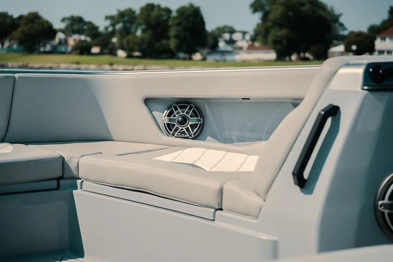  Yacht Photos Pics Interior of 2026 Deep Impact 499 Sport boat with sleek seating and speaker system.