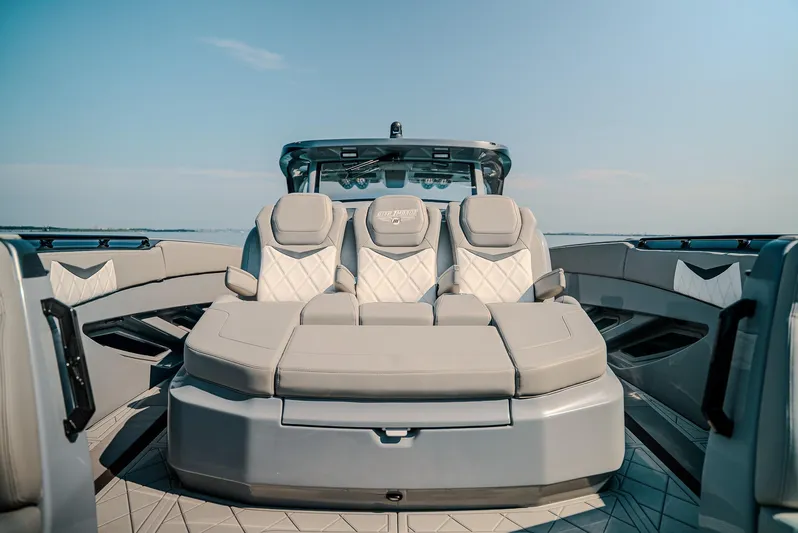  Yacht Photos Pics Luxurious seating on 2026 Deep Impact 499 Sport boat, featuring modern design and comfort.
