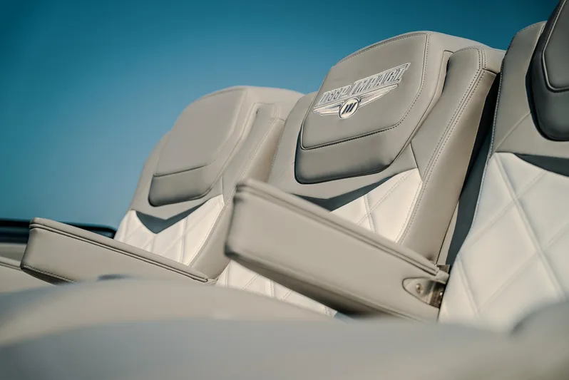  Yacht Photos Pics Luxurious seating on 2026 Deep Impact 499 Sport boat, featuring elegant design and comfort.