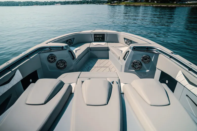  Yacht Photos Pics Luxurious 2026 Deep Impact 499 Sport boat interior with sleek seating and modern design on a serene lake.