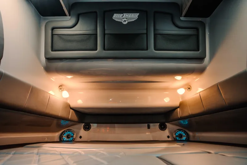  Yacht Photos Pics Interior of 2026 Deep Impact 499 Sport boat with ambient lighting and cushioned seating.