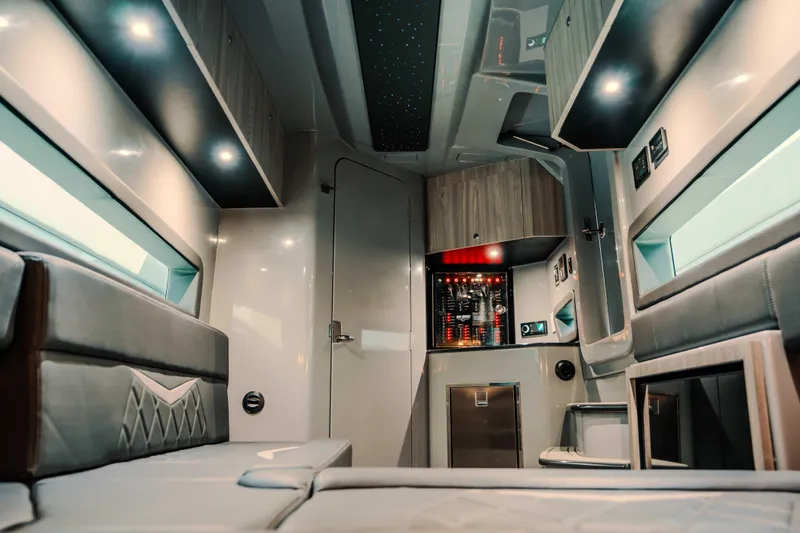  Yacht Photos Pics Luxurious interior of 2026 Deep Impact 499 Sport boat with modern amenities and ambient lighting.