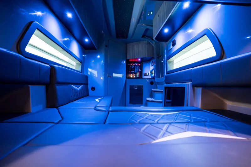  Yacht Photos Pics Luxurious interior of 2026 Deep Impact 499 Sport, featuring modern blue lighting and sleek design.