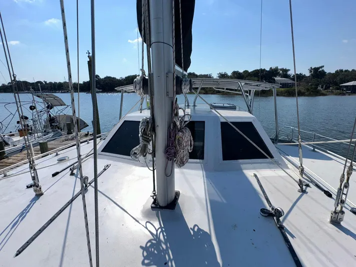 Sola Fide Yacht Photos Pics Sailboat deck view, 1993 Russell Yachts Crowther, moored on a sunny day.