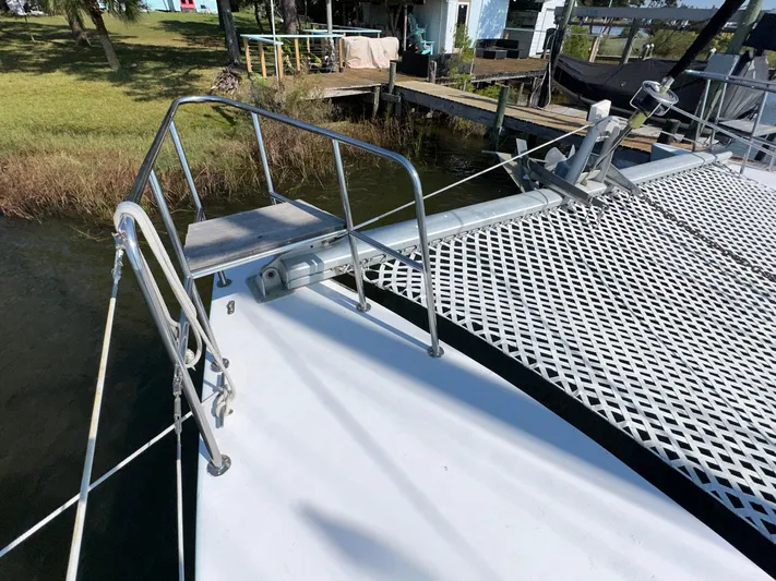 Sola Fide Yacht Photos Pics Deck of 1993 Russell Yachts Crowther catamaran with netting and railing.