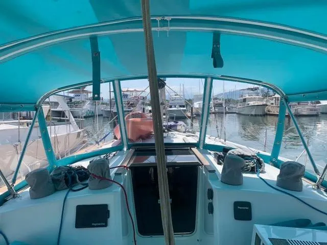  Yacht Photos Pics Cockpit view of 2002 Jeanneau Sun Odyssey 40 sailboat in marina.