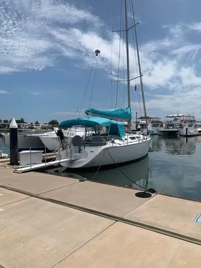  Yacht Photos Pics 2002 Jeanneau Sun Odyssey 40 sailboat docked at marina under clear sky.