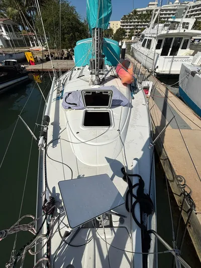  Yacht Photos Pics 2002 Jeanneau Sun Odyssey 40 sailboat docked at marina, top deck view.