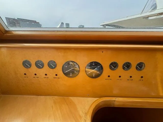  Yacht Photos Pics Dashboard of a 2000 McKinna 57 Pilothouse yacht with gauges and controls.