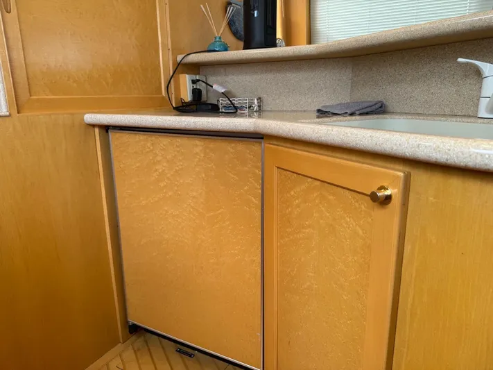  Yacht Photos Pics Wooden cabinetry in 2000 McKinna 57 Pilothouse yacht kitchen area.