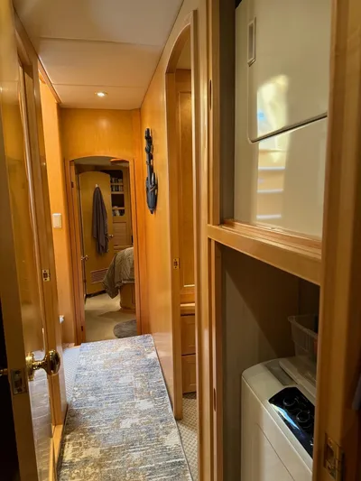  Yacht Photos Pics Interior hallway of 2000 McKinna 57 Pilothouse yacht with laundry area.
