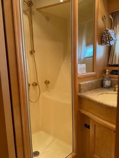 Yacht Photos Pics Luxurious bathroom in 2000 McKinna 57 Pilothouse yacht with shower and vanity.