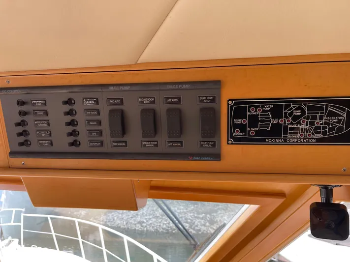  Yacht Photos Pics Control panel of a 2000 McKinna 57 Pilothouse yacht, featuring switches and a schematic diagram.