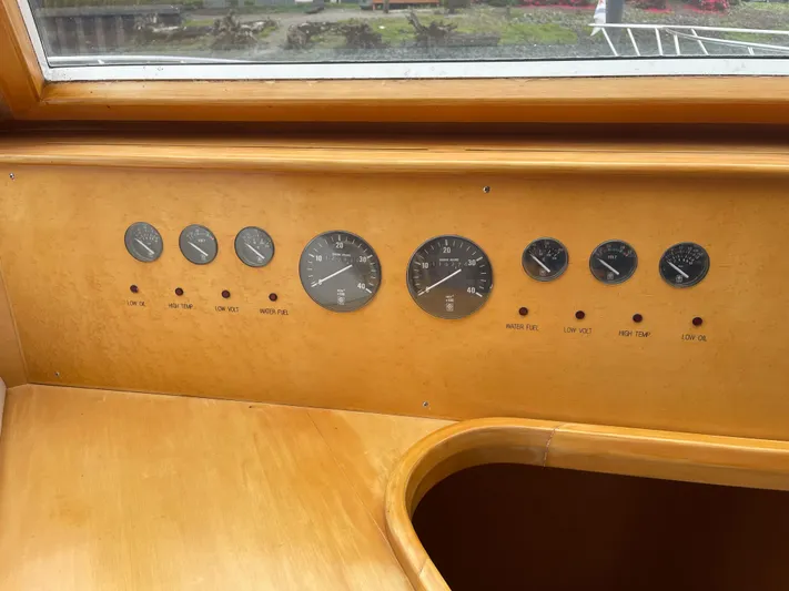  Yacht Photos Pics Control panel of a 2000 McKinna 57 Pilothouse yacht with gauges and indicators.