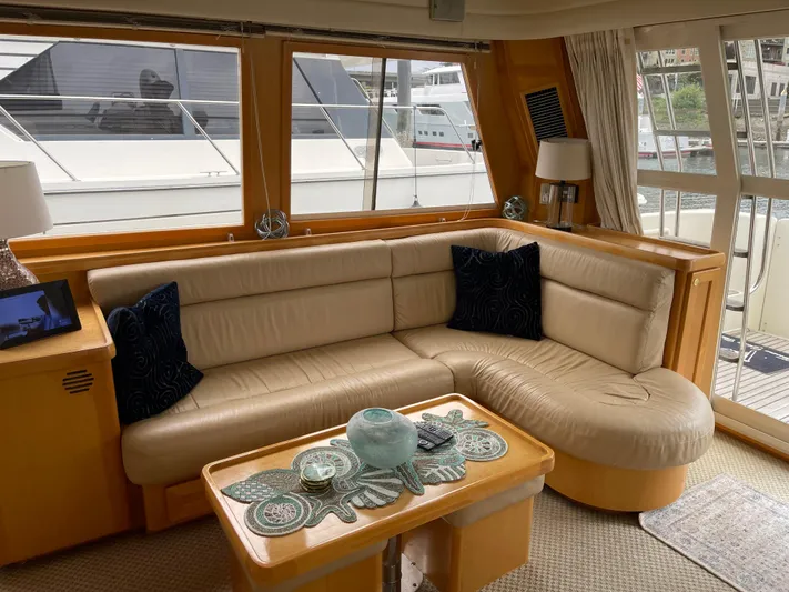 Yacht Photos Pics Luxurious interior of 2000 McKinna 57 Pilothouse yacht with elegant seating and decor.