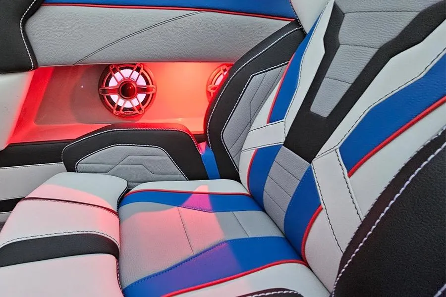 2026 American Marine Performance 393 CAT interior with vibrant upholstery and illuminated speakers.