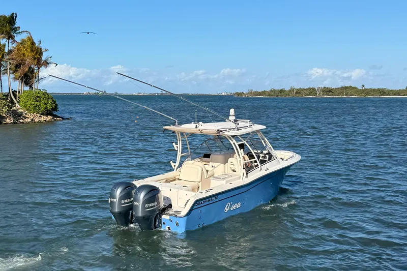 275-264 Brokerage Joe Yacht Photos Pics 2022 Grady-White Freedom 275 boat cruising on a sunny day in open water.