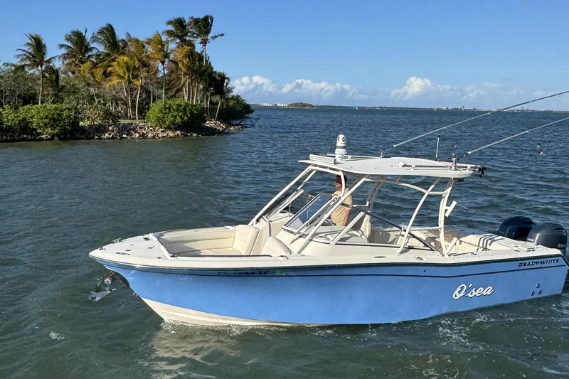 275-264 Brokerage Joe Yacht Photos Pics 2022 Grady-White Freedom 275 boat cruising near tropical island.