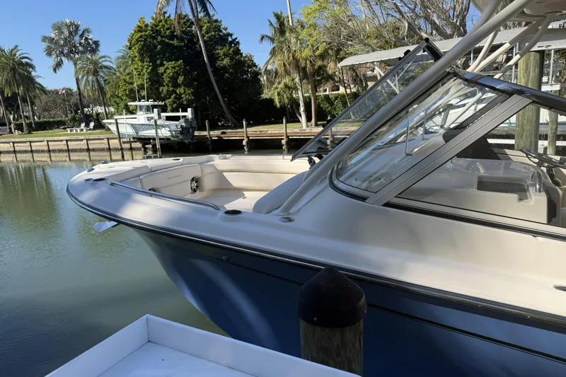 275-264 Brokerage Joe Yacht Photos Pics 2022 Grady-White Freedom 275 boat docked in a serene marina setting.