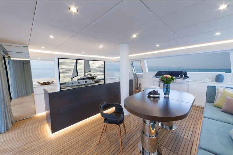  Yacht Photos Pics Luxurious interior of 2026 Sunreef 60 yacht with modern decor and ocean view.